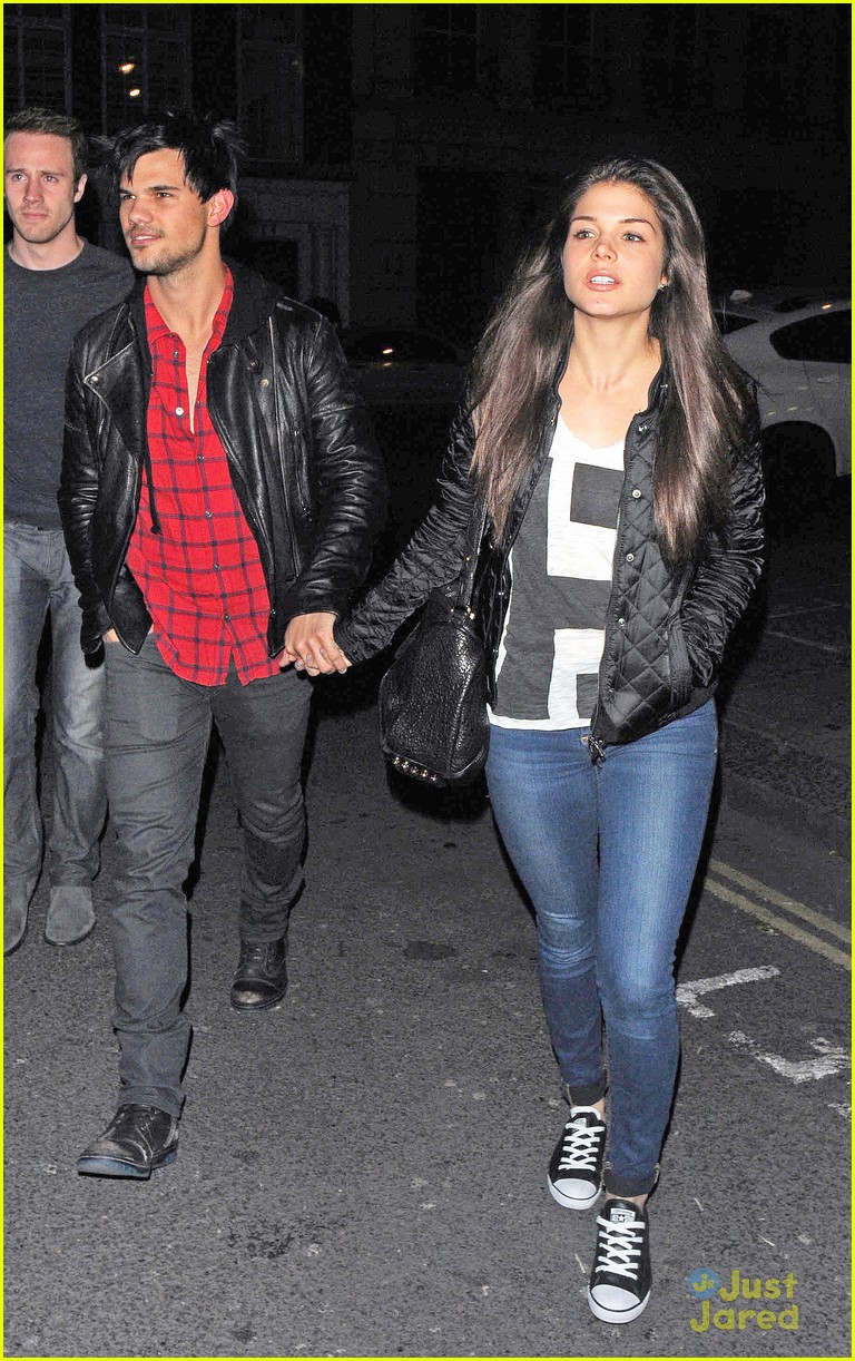 taylor lautner marie avgeropoulos matching jackets london 09
